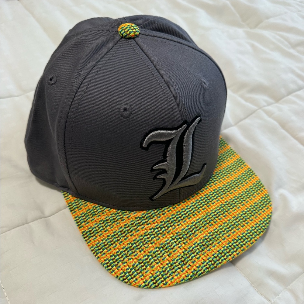 University of Louisville SnapBack Large “L” logo with knitted bill and button.